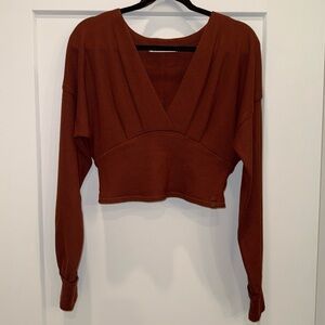 New without tags! We The Free Deep Rust V-Neck Top